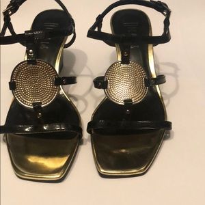 Black and gold wedge heels